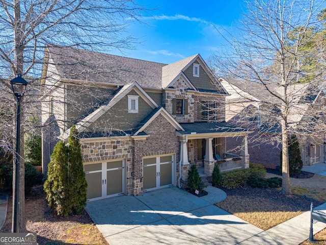 craftsman house featuring a garage and covered porch