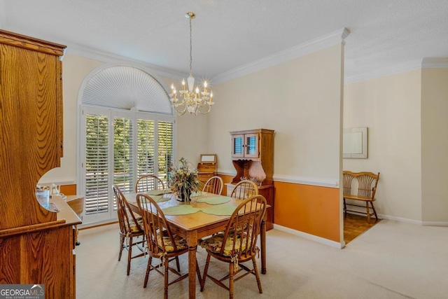 dining room featuring ornamental molding, light carpet, and a notable chandelier