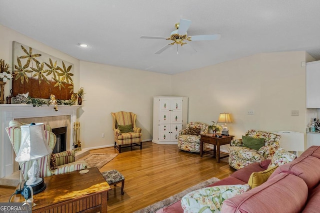 living room with hardwood / wood-style floors and ceiling fan