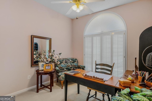 office with light colored carpet and ceiling fan