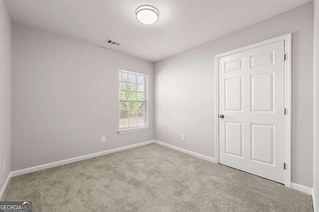 empty room with light carpet