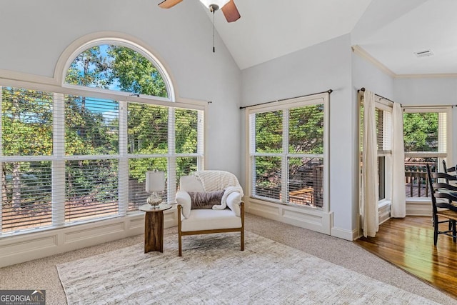 sunroom featuring ceiling fan and vaulted ceiling