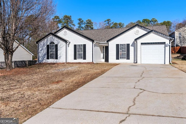 ranch-style home with a garage