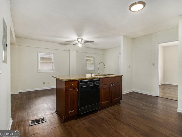 kitchen with dishwasher, sink, dark hardwood / wood-style flooring, light stone counters, and plenty of natural light