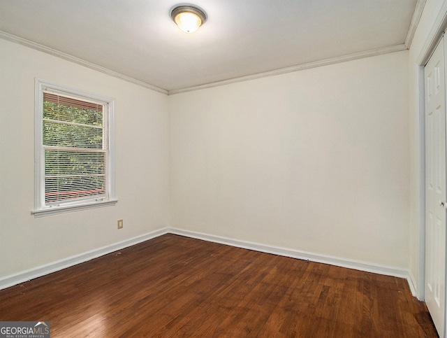 unfurnished room featuring crown molding and hardwood / wood-style flooring