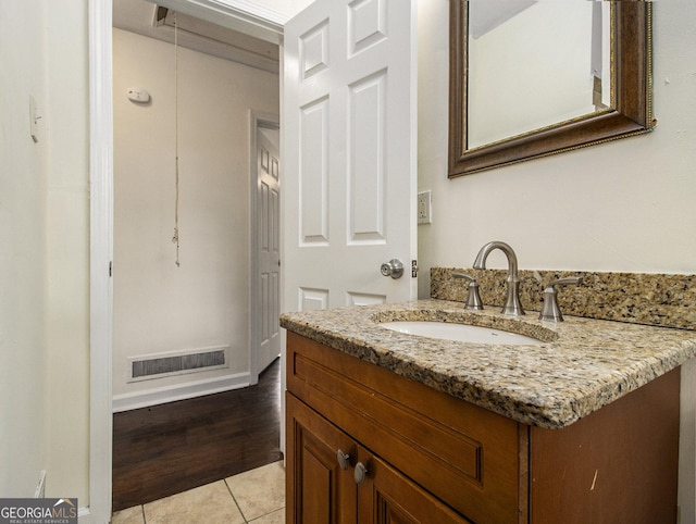 bathroom with tile patterned flooring and vanity