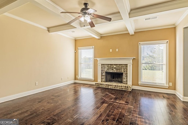 unfurnished living room with dark hardwood / wood-style flooring, beam ceiling, a fireplace, and coffered ceiling