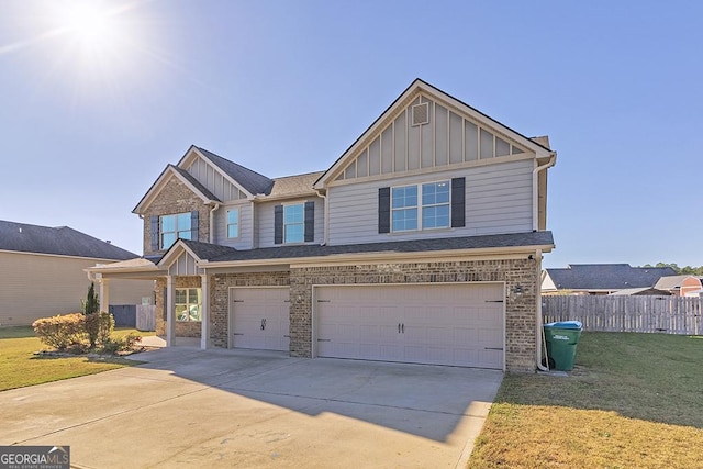 view of front of home featuring a garage and a front lawn