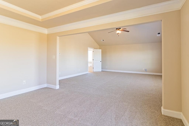 spare room featuring ornamental molding, carpet, and ceiling fan