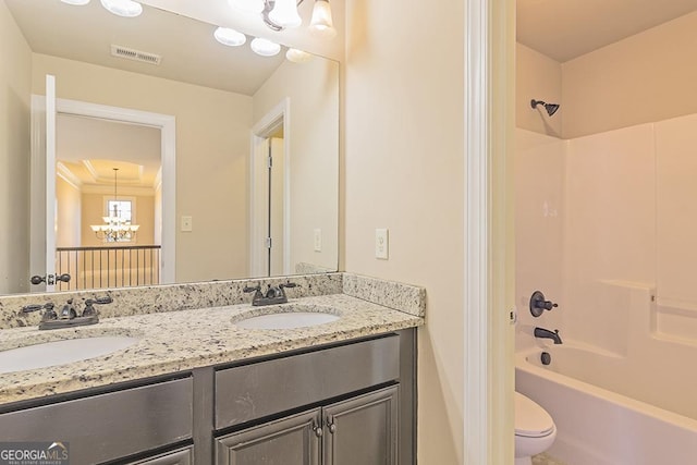 full bathroom with vanity, a notable chandelier, toilet, and shower / bath combination