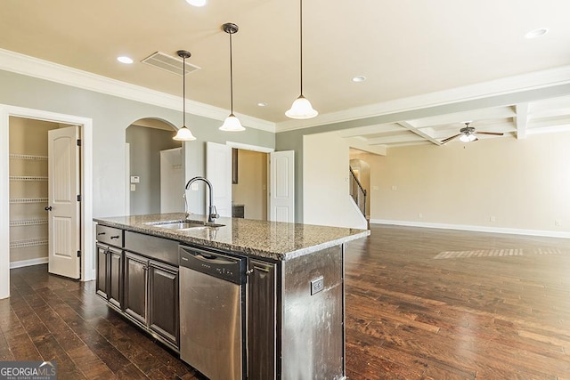 kitchen featuring pendant lighting, sink, stainless steel dishwasher, dark brown cabinetry, and light stone counters