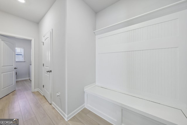 mudroom with light hardwood / wood-style flooring