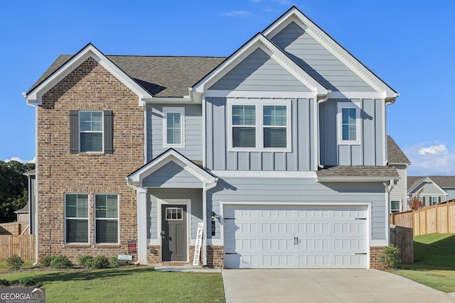 view of front of property featuring a garage and a front lawn