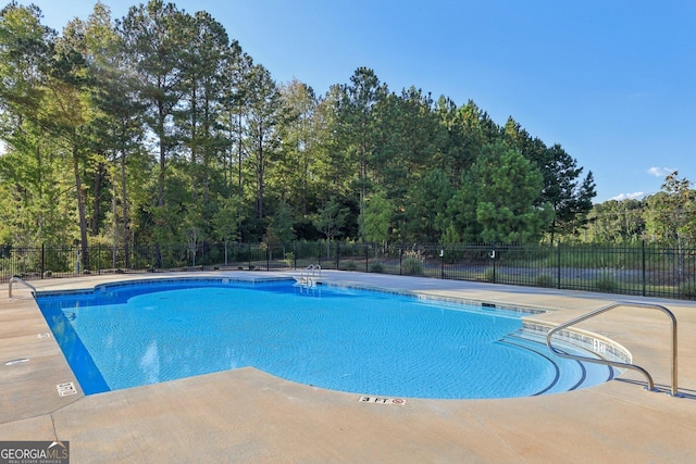 view of pool featuring a patio area