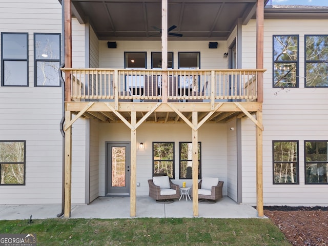 back of house featuring a ceiling fan and a patio area