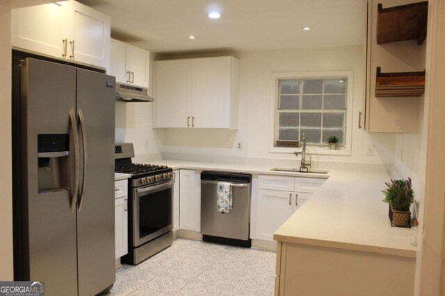 507 Augusta Dr SE, Marietta, GA 30067 - kitchen with stainless steel appliances, white cabinetry, and sink