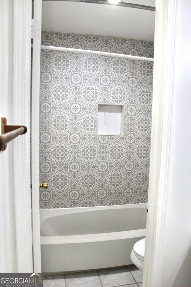 507 Augusta Dr SE, Marietta, GA 30067 - bathroom with tile patterned floors, toilet, and shower / washtub combination