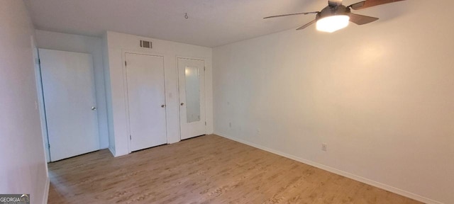 507 Augusta Dr SE, Marietta, GA 30067 - unfurnished bedroom featuring light hardwood / wood-style flooring, a closet, and ceiling fan