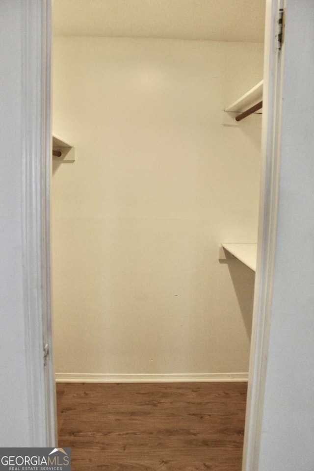 507 Augusta Dr SE, Marietta, GA 30067 - walk in closet featuring wood-type flooring