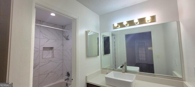 507 Augusta Dr SE, Marietta, GA 30067 - bathroom with vanity and tiled shower / bath combo
