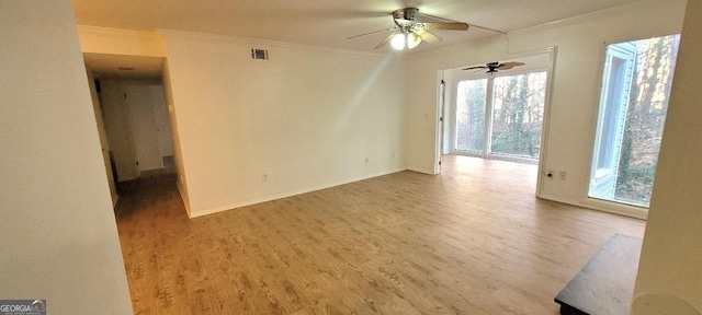 507 Augusta Dr SE, Marietta, GA 30067 - spare room with crown molding, ceiling fan, and hardwood / wood-style flooring