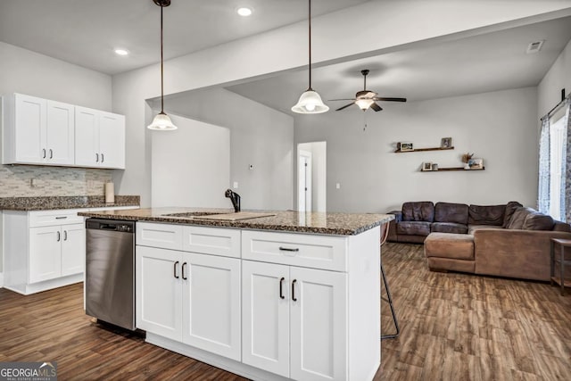 kitchen with pendant lighting, white cabinetry, dishwasher, sink, and a kitchen island with sink