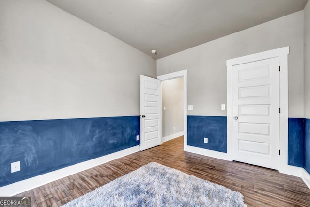 bedroom featuring dark hardwood / wood-style flooring