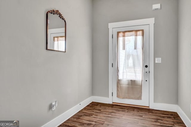 doorway featuring plenty of natural light and hardwood / wood-style floors