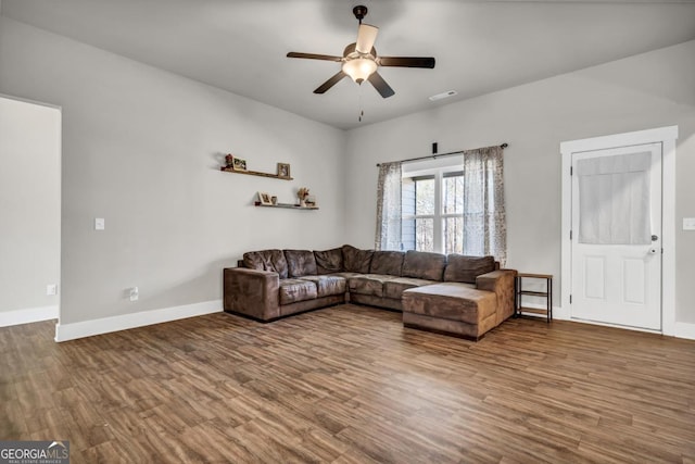 living room with hardwood / wood-style flooring and ceiling fan