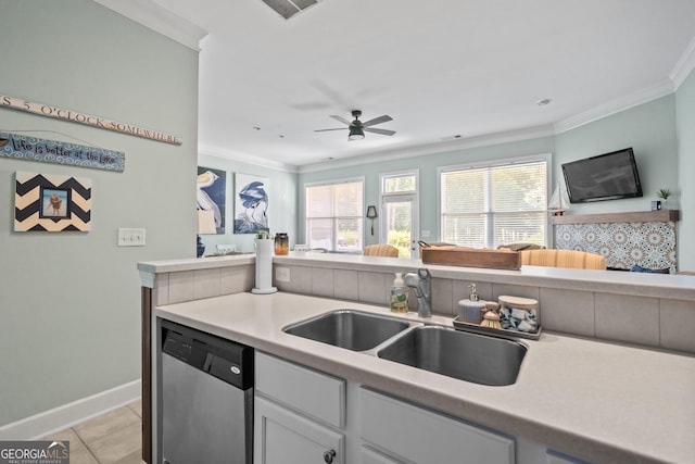 kitchen featuring sink, crown molding, light tile patterned floors, dishwasher, and ceiling fan