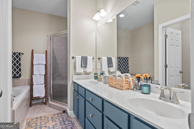 bathroom featuring vanity, separate shower and tub, and tile patterned floors