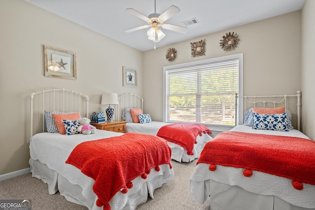 carpeted bedroom with ceiling fan