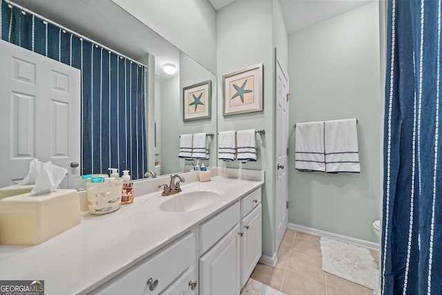 bathroom with tile patterned floors, toilet, and vanity