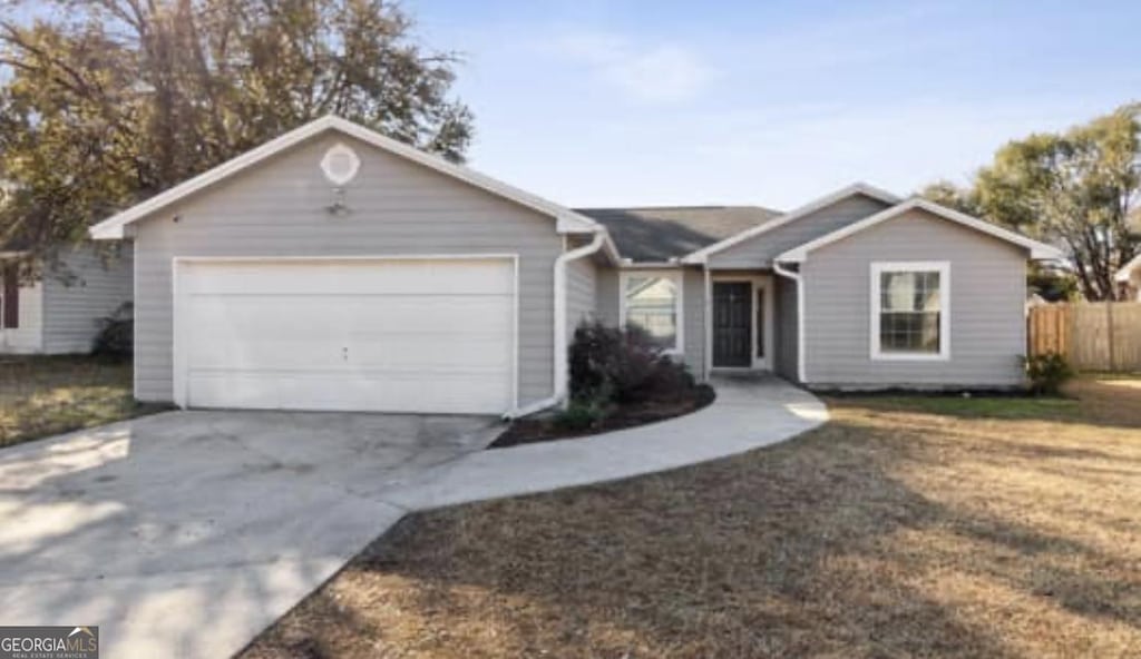 ranch-style home with a garage