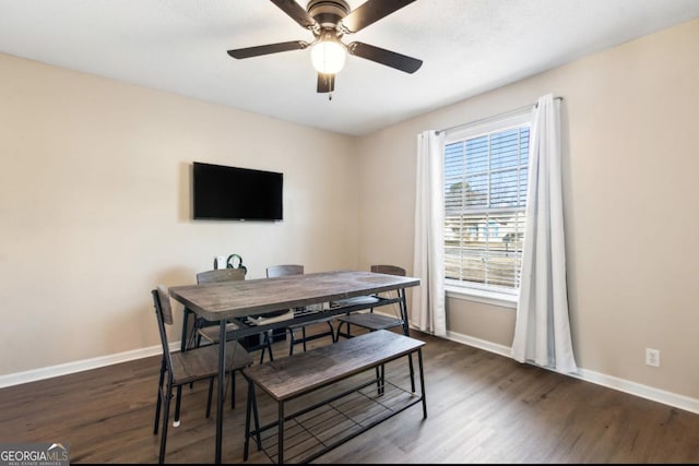 dining area with dark hardwood / wood-style floors and ceiling fan