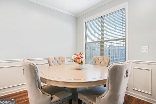 dining space with crown molding and dark hardwood / wood-style flooring