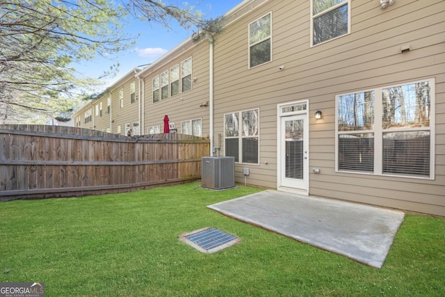 back of property featuring cooling unit, a patio area, and a lawn