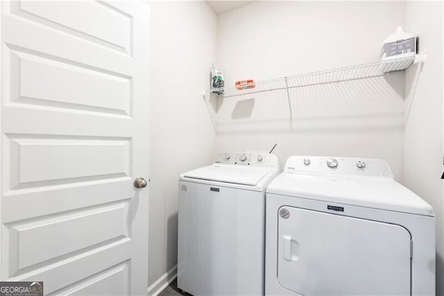 laundry room with independent washer and dryer