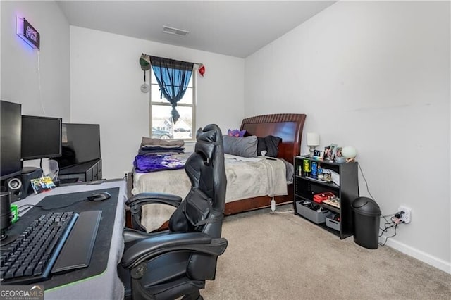 bedroom featuring light carpet