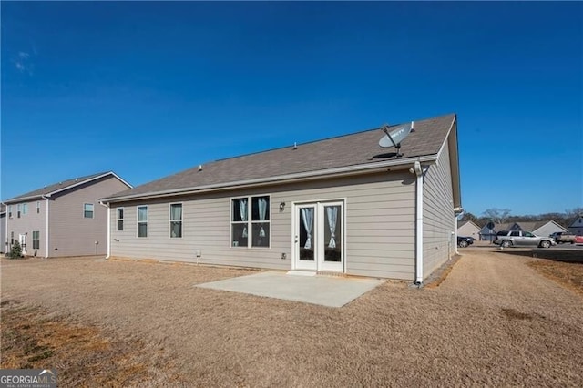 rear view of property featuring a patio area