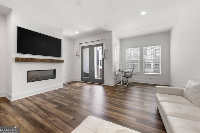 unfurnished living room featuring dark hardwood / wood-style floors and french doors