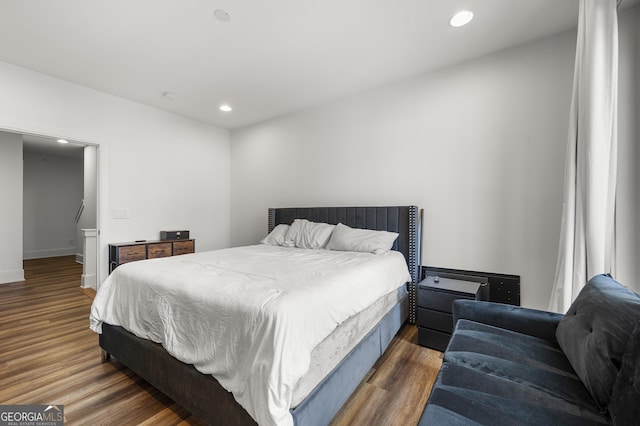 bedroom featuring dark hardwood / wood-style flooring