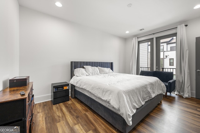 bedroom featuring access to exterior and dark hardwood / wood-style floors