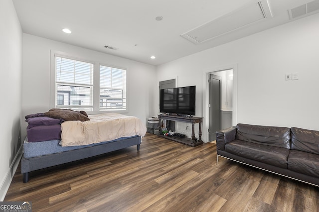 bedroom with dark wood-type flooring