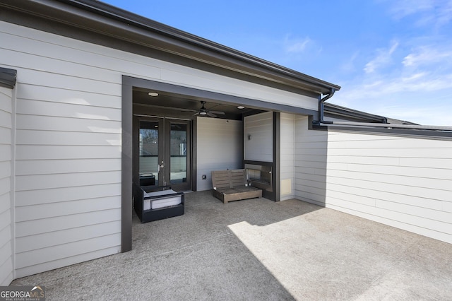 view of patio with french doors and ceiling fan