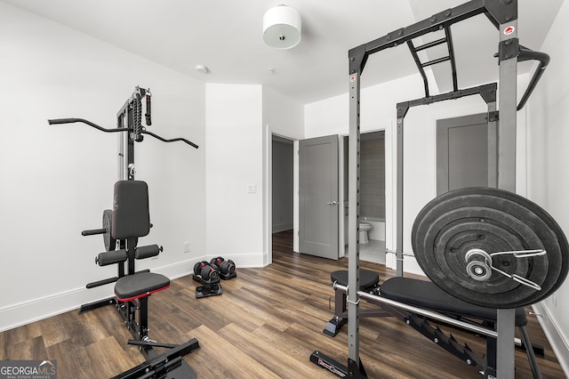 workout area with hardwood / wood-style flooring