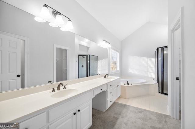 bathroom featuring lofted ceiling, vanity, tile patterned floors, and shower with separate bathtub