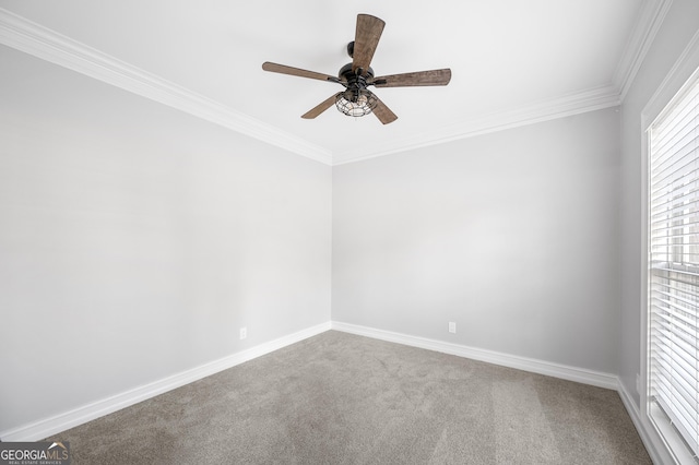 carpeted empty room with ornamental molding and ceiling fan