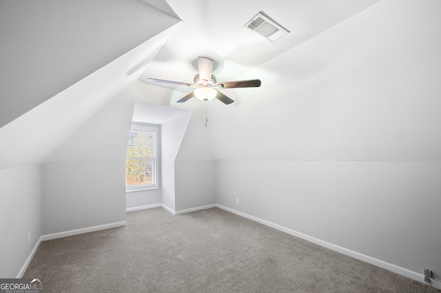 bonus room featuring ceiling fan, lofted ceiling, and light carpet