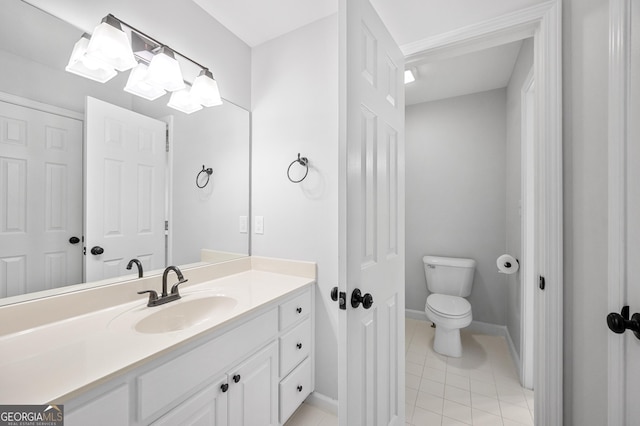 bathroom with tile patterned floors, toilet, and vanity